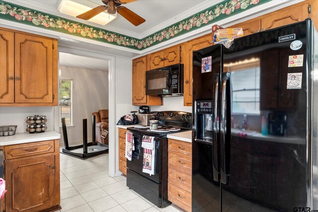 kitchen with black appliances, light tile patterned flooring, ceiling fan, and ornamental molding