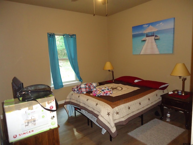 1323 Cummins St, Palestine, TX 75801 - bedroom with wood finished floors and baseboards