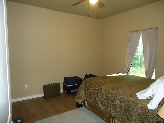 1323 Cummins St, Palestine, TX 75801 - bedroom featuring wood finished floors, baseboards, and ceiling fan