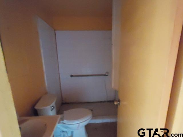 2401 E Fm 852, Winnsboro, TX 75494 - bathroom featuring vanity and toilet
