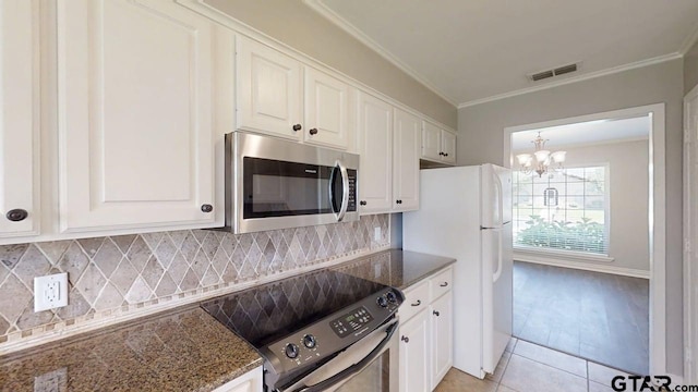 518 Meadow Creek Dr, Tyler, TX 75703 - kitchen featuring stainless steel appliances, a chandelier, light tile patterned flooring, crown molding, and white cabinets