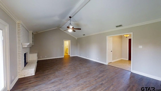518 Meadow Creek Dr, Tyler, TX 75703 - unfurnished living room with a ceiling fan, dark wood-style flooring, a fireplace, vaulted ceiling, and crown molding