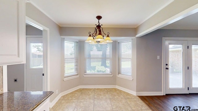 518 Meadow Creek Dr, Tyler, TX 75703 - unfurnished dining area with a chandelier, ornamental molding, and light tile patterned floors