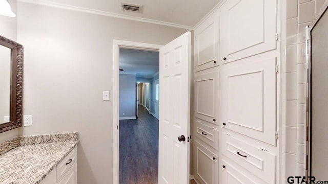 518 Meadow Creek Dr, Tyler, TX 75703 - bathroom with ornamental molding, vanity, and wood finished floors