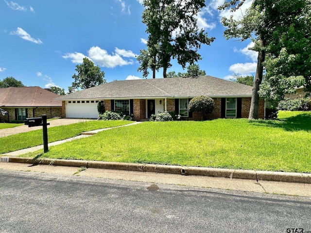 518 Meadow Creek Dr, Tyler, TX 75703 - ranch-style house with an attached garage, driveway, a front yard, and brick siding