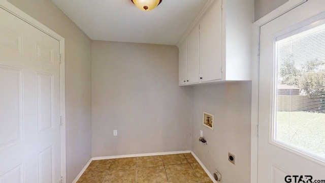 518 Meadow Creek Dr, Tyler, TX 75703 - laundry area featuring cabinet space, hookup for an electric dryer, healthy amount of natural light, and washer hookup
