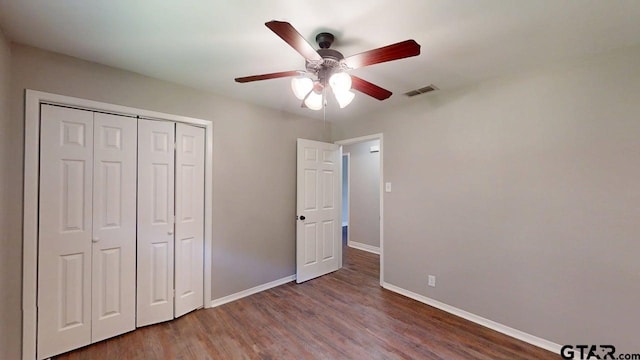 518 Meadow Creek Dr, Tyler, TX 75703 - unfurnished bedroom with wood finished floors, a closet, and ceiling fan