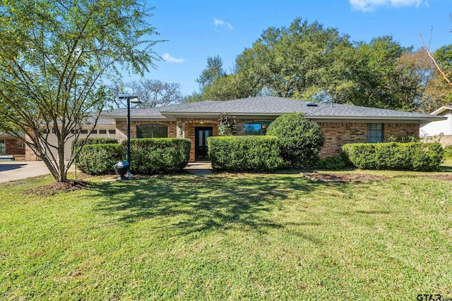 ranch-style home featuring a front yard