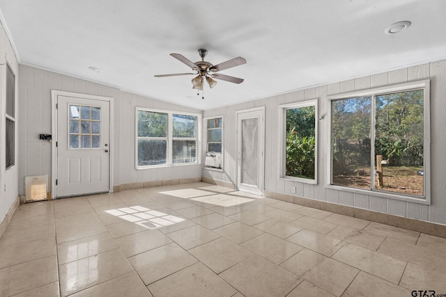 interior space featuring ceiling fan and vaulted ceiling