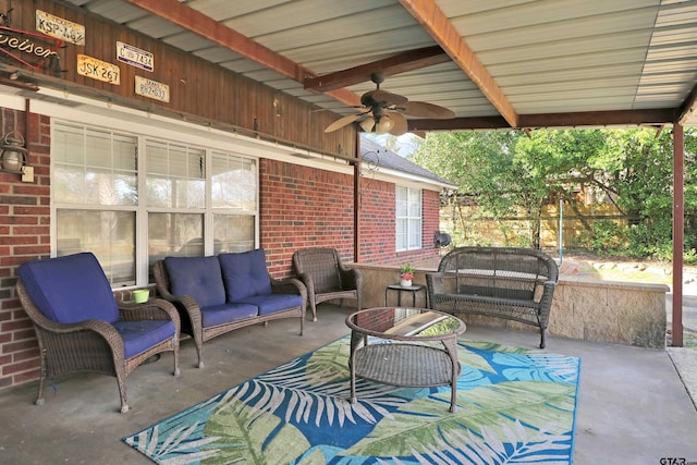 view of patio / terrace with ceiling fan and an outdoor living space