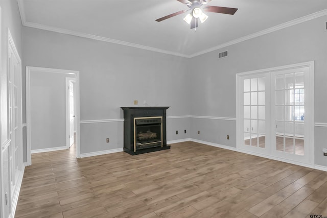 unfurnished living room with ceiling fan, light hardwood / wood-style flooring, and ornamental molding