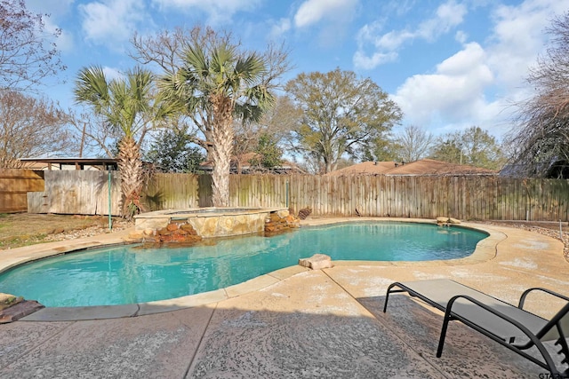 view of pool featuring an in ground hot tub