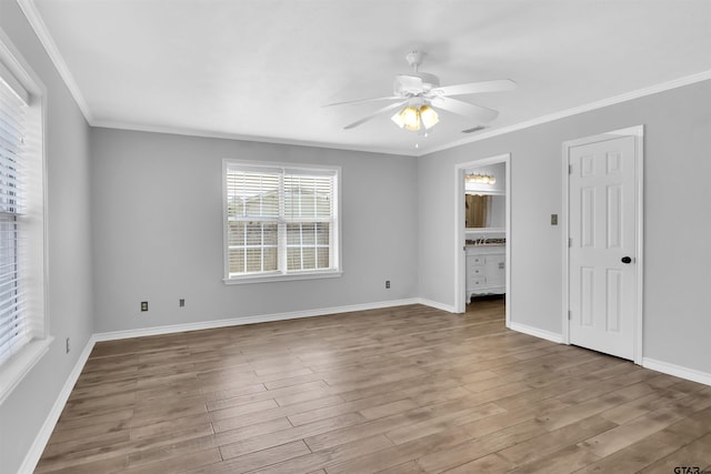 unfurnished room with ceiling fan, wood-type flooring, and crown molding