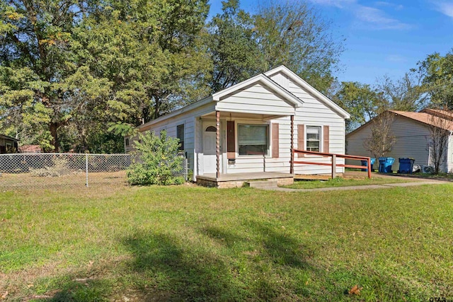 bungalow-style house featuring a front lawn