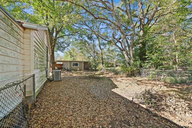 view of yard with central AC