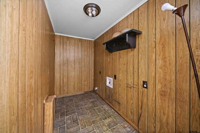 washroom with crown molding, hookup for a washing machine, and wood walls