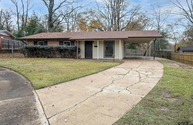 ranch-style house with a front lawn and a carport