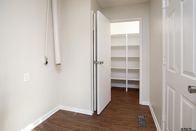 hall featuring dark hardwood / wood-style floors