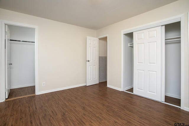 unfurnished bedroom featuring dark hardwood / wood-style floors