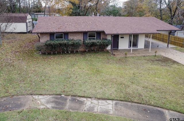 single story home with a patio area and a front lawn