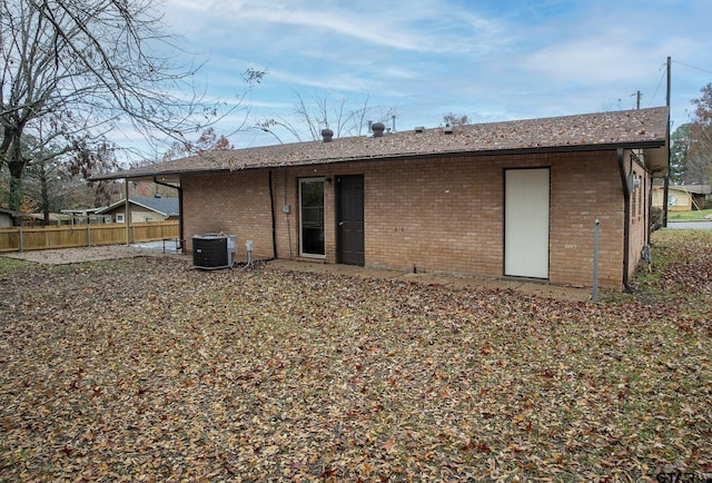 rear view of house with central AC