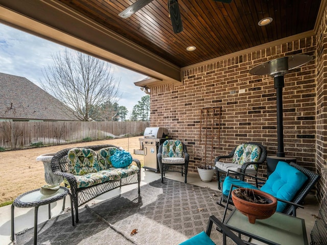 view of patio / terrace featuring a grill, outdoor lounge area, and fence