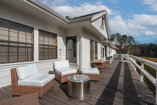 wooden terrace with outdoor lounge area