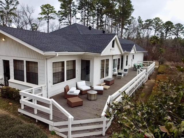 rear view of house with a deck