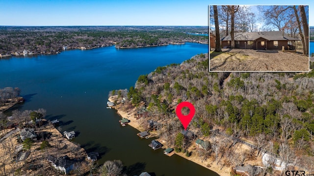 birds eye view of property featuring a water view