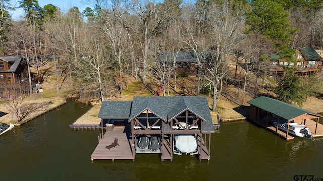 dock area with a water view and boat lift