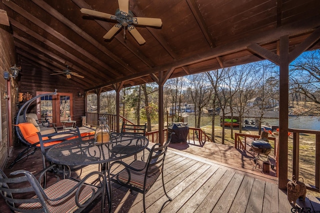 deck with ceiling fan and outdoor dining area