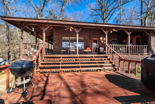 deck with stairway, a grill, and a ceiling fan