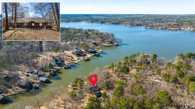 birds eye view of property with a water view