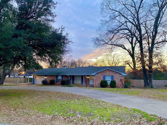 single story home featuring a yard