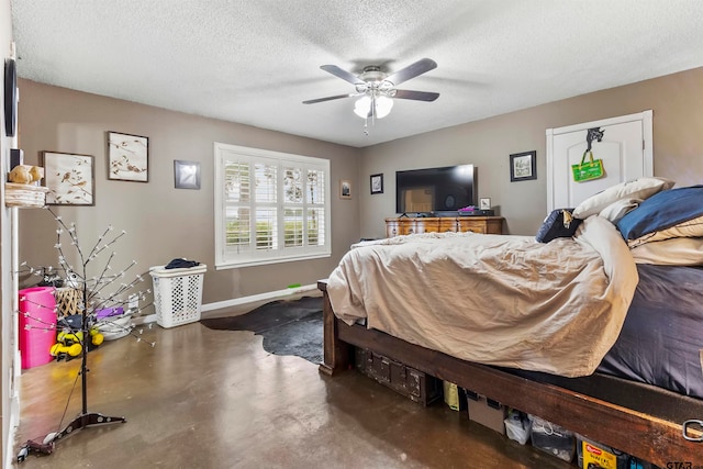 bedroom with ceiling fan and a textured ceiling