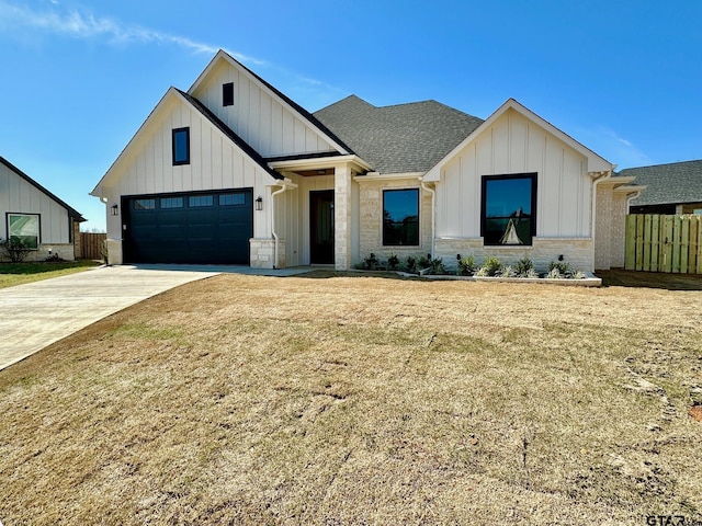 modern farmhouse style home with a garage and a front yard