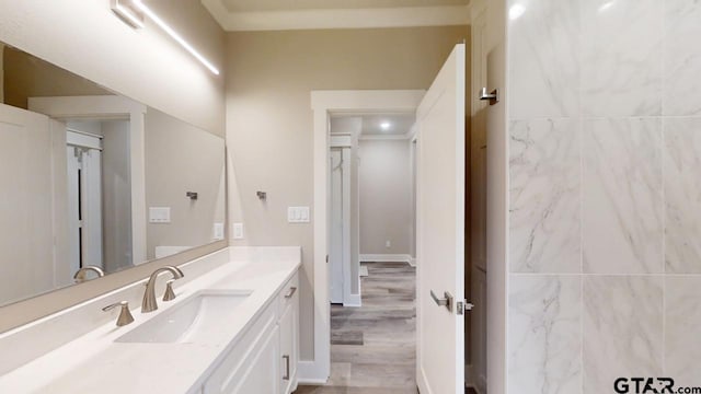 bathroom with vanity and hardwood / wood-style floors