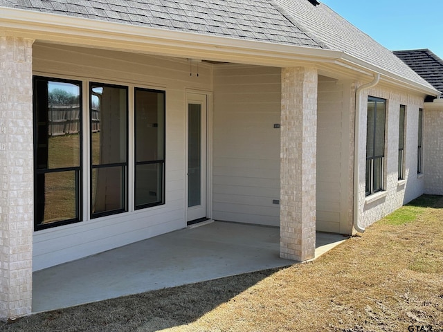 view of exterior entry featuring a patio