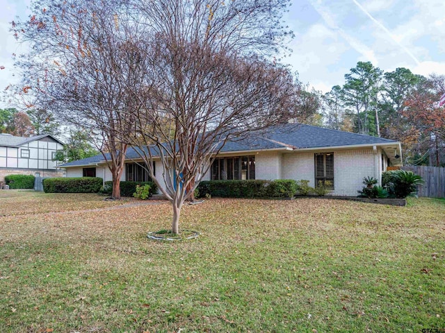 ranch-style house with a front lawn