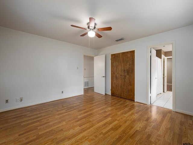 unfurnished bedroom featuring light hardwood / wood-style floors and ceiling fan