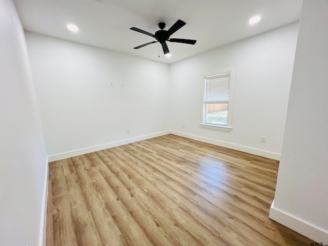 spare room featuring ceiling fan and light hardwood / wood-style floors