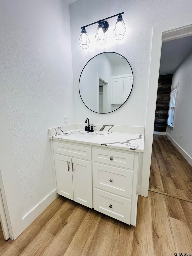 bathroom featuring hardwood / wood-style floors and vanity