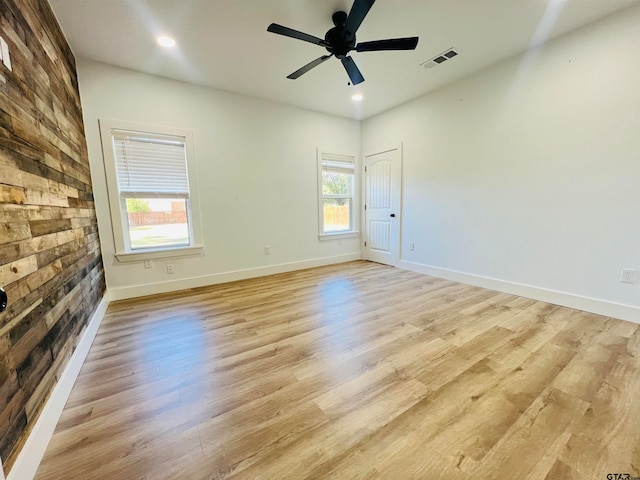 spare room featuring ceiling fan and light hardwood / wood-style floors