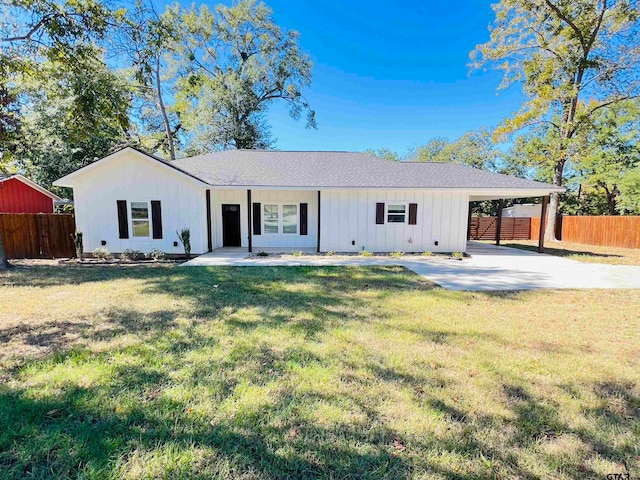 single story home with a front lawn and a carport