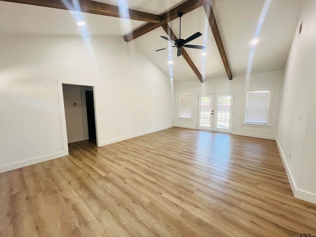 unfurnished living room featuring french doors, high vaulted ceiling, beamed ceiling, ceiling fan, and light wood-type flooring