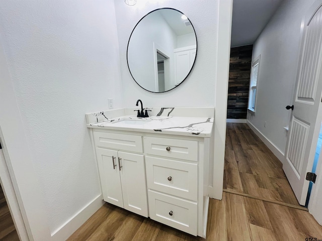 bathroom featuring vanity and hardwood / wood-style flooring