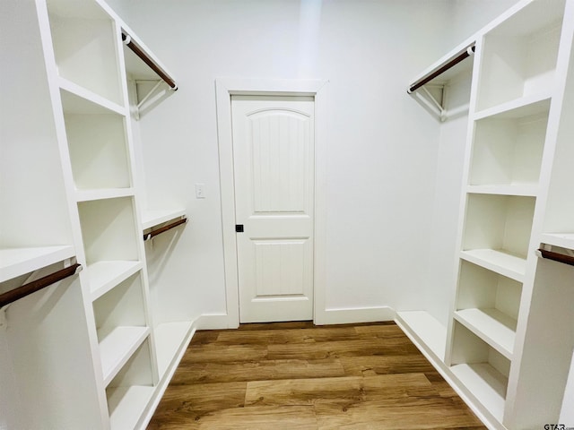 walk in closet featuring wood-type flooring