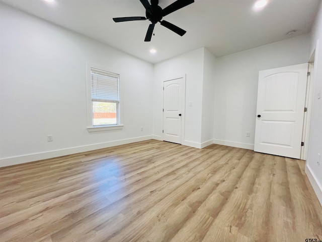 unfurnished room featuring light hardwood / wood-style floors and ceiling fan