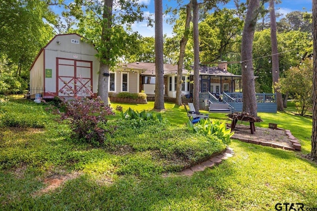 23324 Bay Side Dr, Bullard, TX 75757 - rear view of property featuring a lawn, a storage unit, and a wooden deck