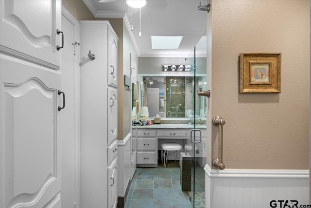 23324 Bay Side Dr, Bullard, TX 75757 - full bathroom with ornamental molding, a skylight, vanity, a stall shower, and ceiling fan